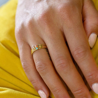 December colour birthstone titanium steel ring with geometric shape and electroplated gold lettering on adjustable sizing band