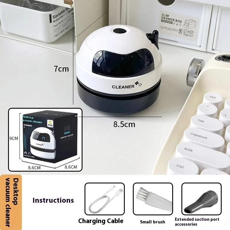 USB-powered handheld desktop vacuum cleaner in blue colour cleaning computer keyboard