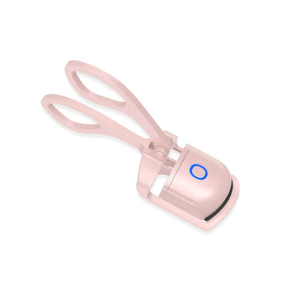 Pink heated electric eyelash curler with USB charging port and curved design with silicone pads