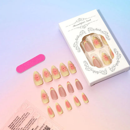 Set of plastic fake nails with pink and white 3D cartoon flowers, jelly glue, and a nail file.
