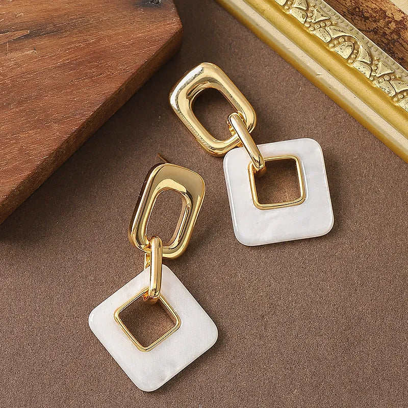 Hollow geometric square earrings with chamfered corners and electroplated copper finish