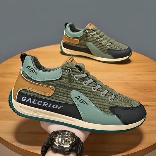 Men's grey and green mesh running shoes with lace-up front and low-top ankle design