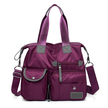 Versatile ladies handbag in various colors with multiple carry options, including handbag, shoulder bag, and crossbody styles, featuring durable construction and organizational pockets.