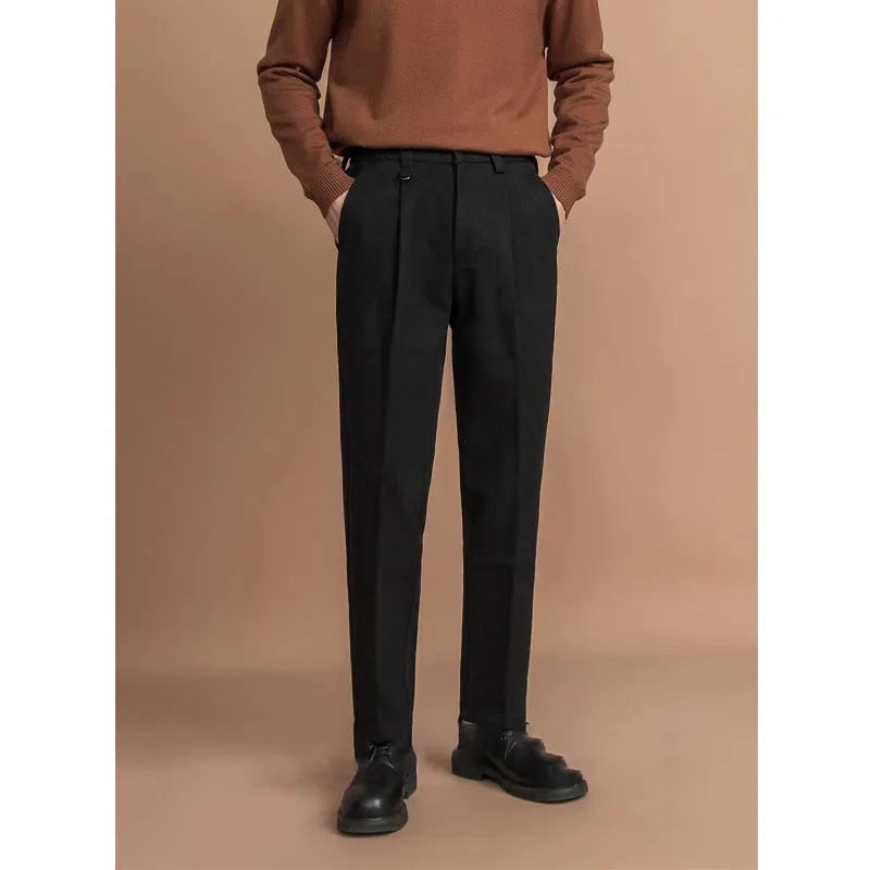 Man wearing straight cut draped polyester casual trousers in dark grey