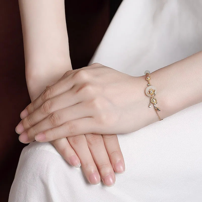 Hetian jade lotus peace buckle bracelet in 925 silver with gold plating, antique retro style