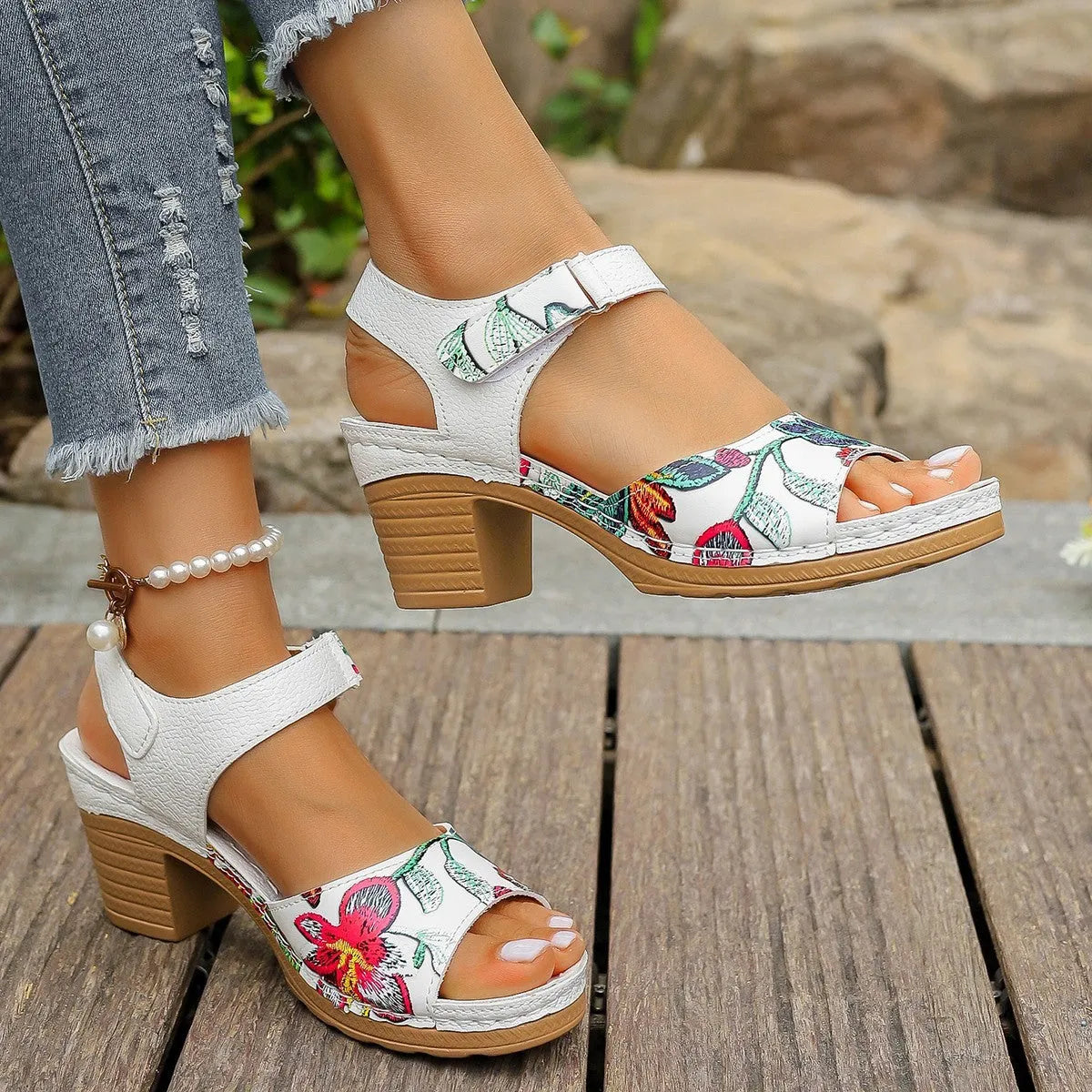 White women's high heel sandals with velcro buckle closure showing PU upper and rubber sole
