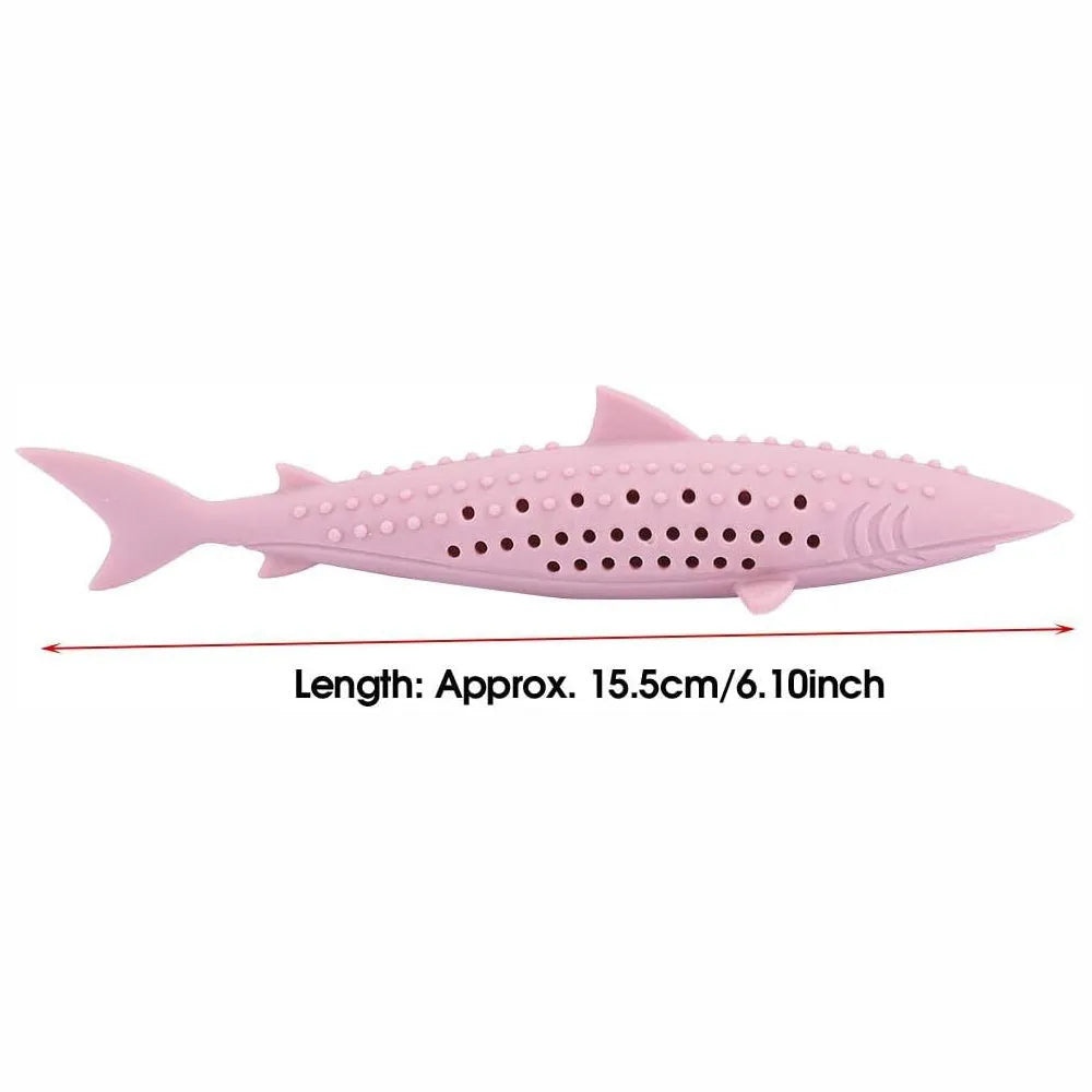Green fish-shaped silicone cat chew toy with side holes, shown disassembled to reveal hollow interior for catnip.