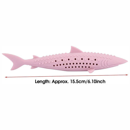 Green fish-shaped silicone cat chew toy with side holes, shown disassembled to reveal hollow interior for catnip.