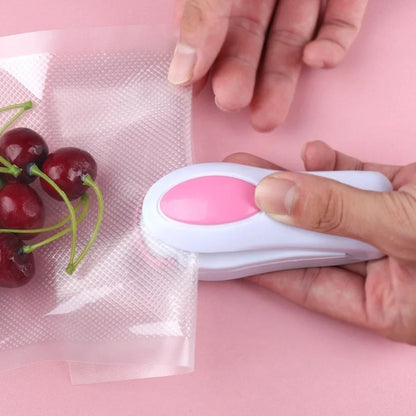 Mini hand pressure heat sealing machine measuring 10cm with magnetic base for plastic bag food preservation