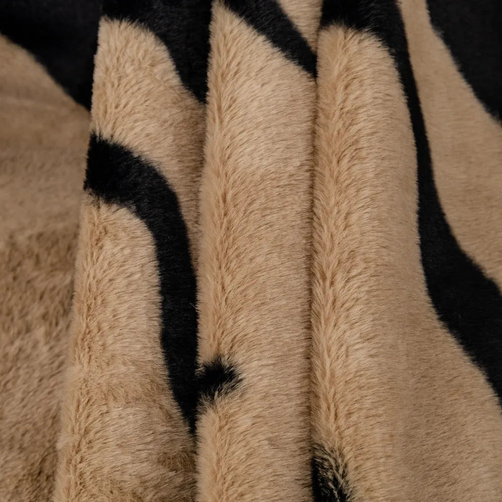 Zebra pattern sofa cover cloth in flannel fabric with non-slip backing, shown in caramel colour on a sofa