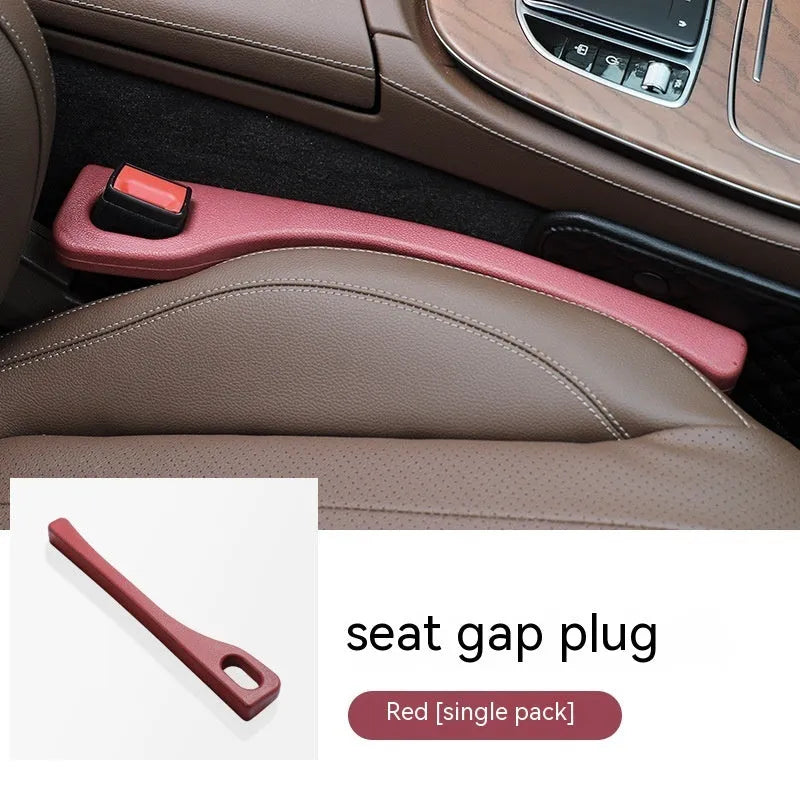 Flexible polyurethane car seat gap filler strip in selected colour next to car keys and phone.