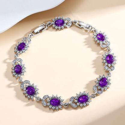 Personality Trend adjustable alloy bracelet with inlaid zircon stones in a choice of nine gemstone colours on a wrist.