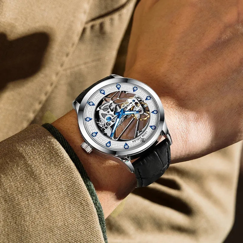 Men's silver case mechanical watch with white dial, blue hands, and black genuine leather strap