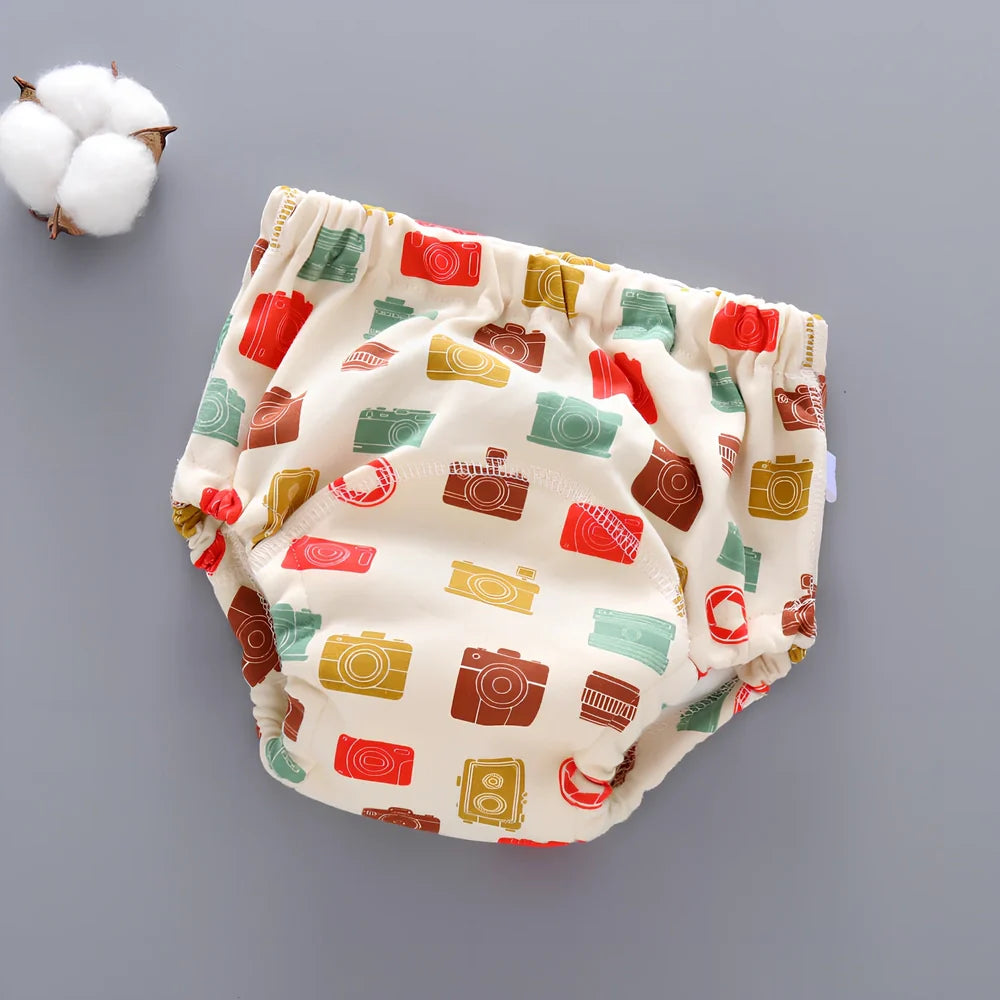 Washable baby training pants with 6-layer gauze construction in assorted patterns including animals and geometric designs