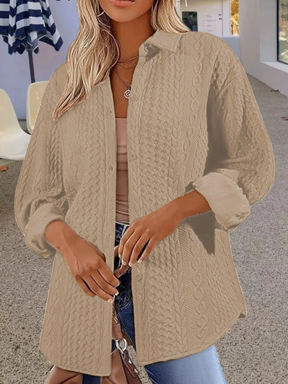 Women's solid colour cardigan sweater in black, shown open as a long-sleeved layer.