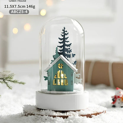 Small 15 cm glass reindeer night lamp in white snowman cabin style casting 100 lumen festive glow on table