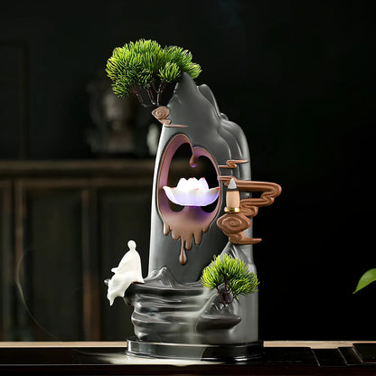 Purple sand tea pet backflow fragrance ornament with LED lighting creating cascading smoke effect