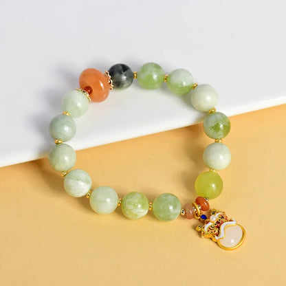 Green milk-in-water Xingshi jade pendant bracelet with geometric retro design on wrist