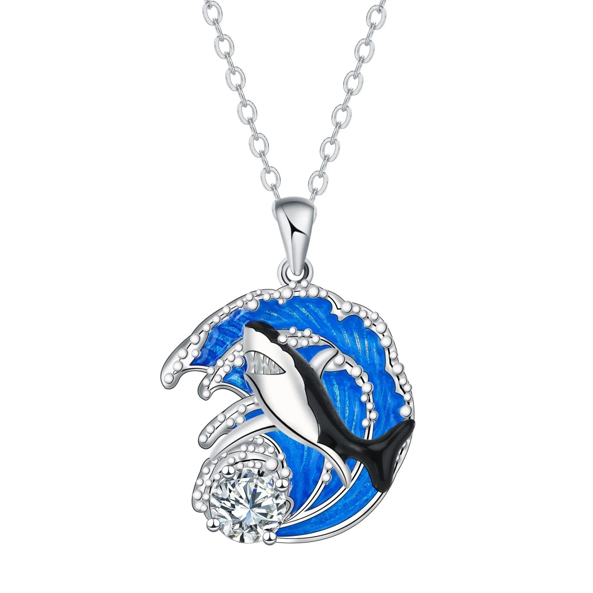 Close-up of a women's shark pendant necklace on a cross chain, showing detailed copper animal modelling.