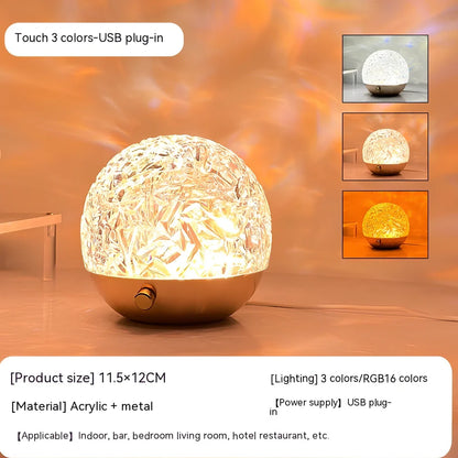 Spherical water ripple projector night light with touch controls creating colourful aurora patterns on wall