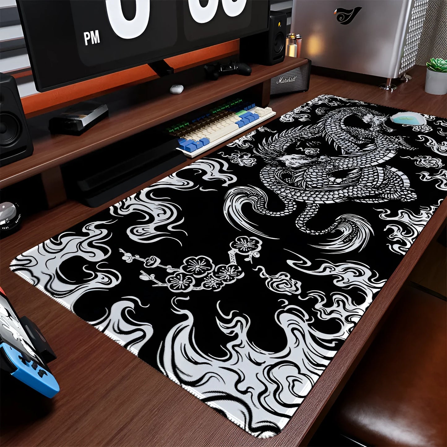 Flower Dragon design cloth mouse pad with non-slip base on a desk, showing size options.