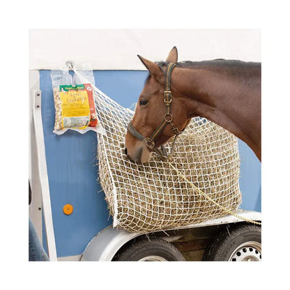 Black woven grid hanging feeding bag for horses, shown against a stable background.