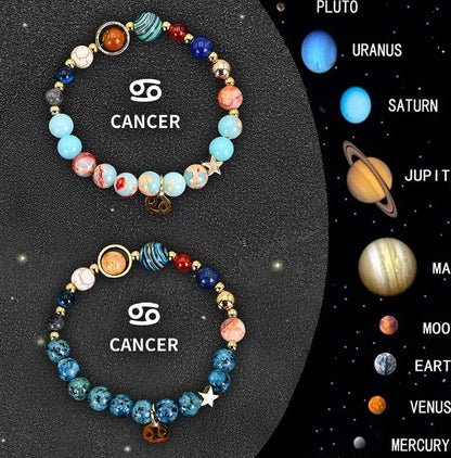 Set of two natural stone beaded bracelets showing zodiac sign designs on an elastic cord.