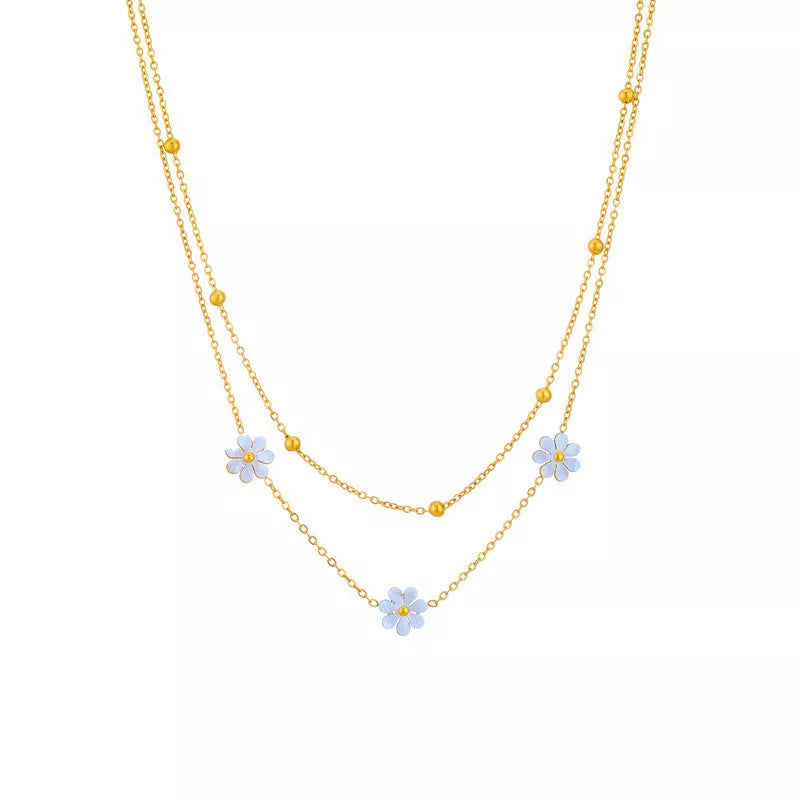 Stainless steel daisy flower jewelry set with necklace, bracelet, and earrings in electroplated gold finish