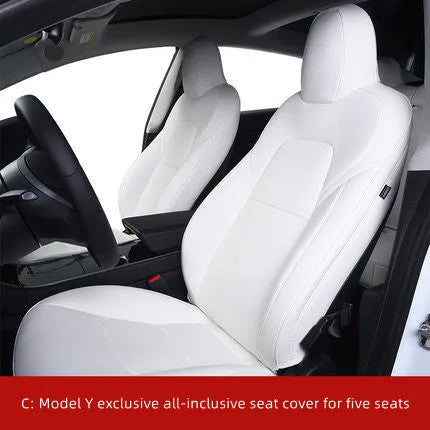 Black PVC seat cover installed on a Tesla Model 3 front seat, showing binding-style edges.