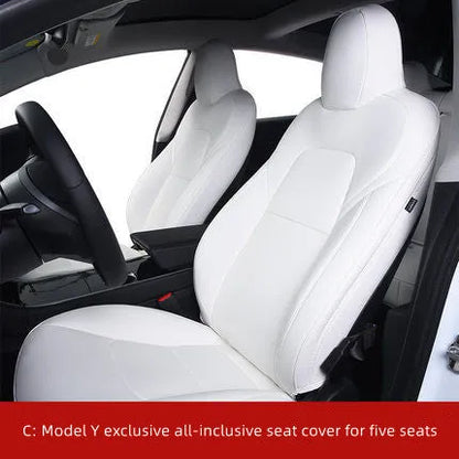 Black PVC seat cover installed on a Tesla Model 3 front seat, showing binding-style edges.