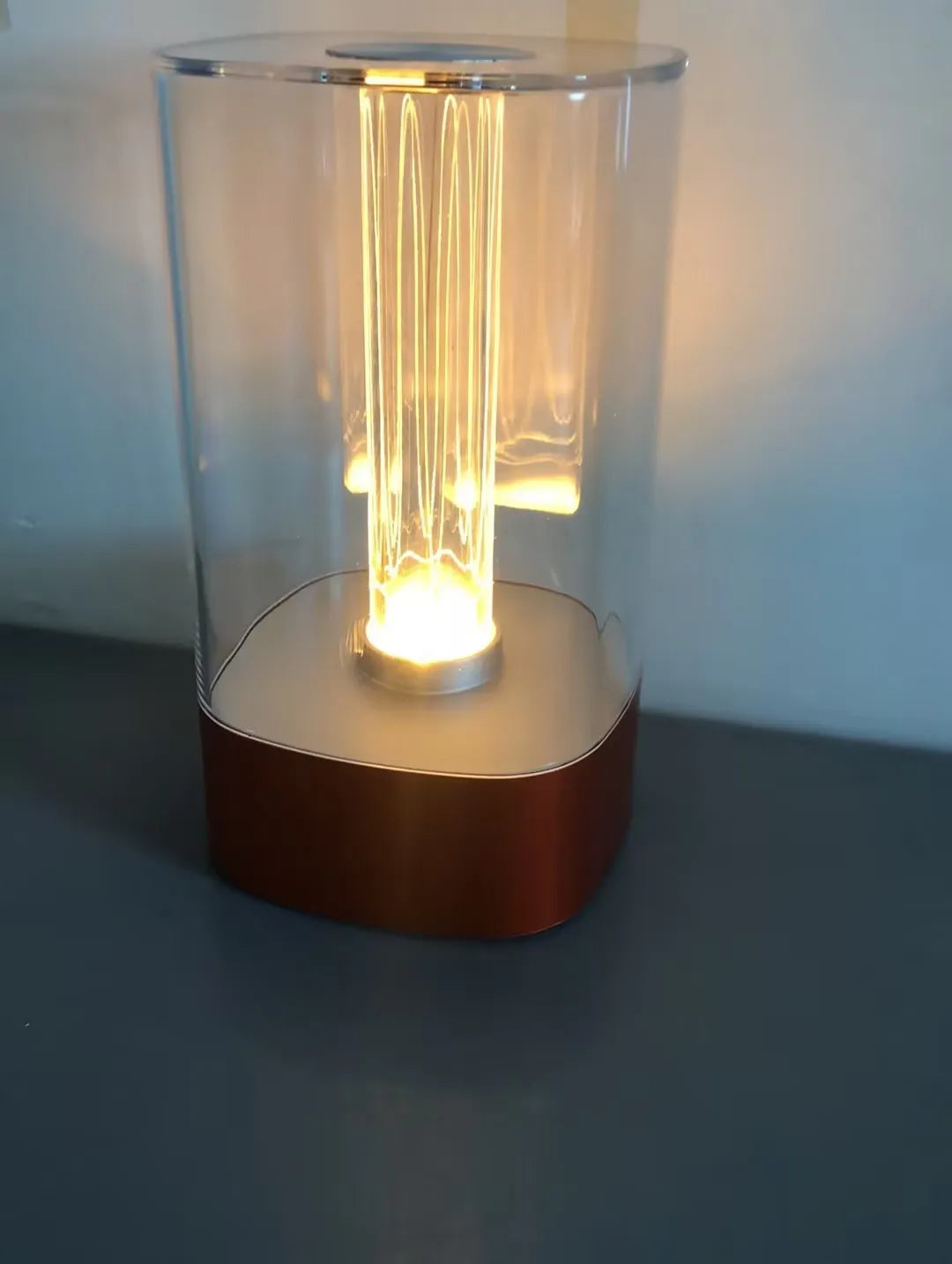 Rose Gold LED touch atmosphere lamp with abstract pattern on bedside table