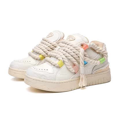Creamy white old damage retro skate shoes with lace-up front, platform heel, and round toe.