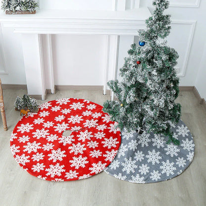 Elegant Christmas tree skirt with plush snowflake design, creating a cozy and festive holiday atmosphere.