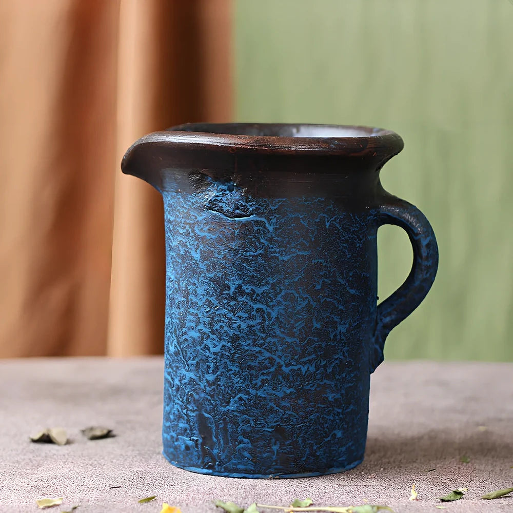 Ceramic mosaic vase with dried flowers, showing mosaic pattern and 25cm height