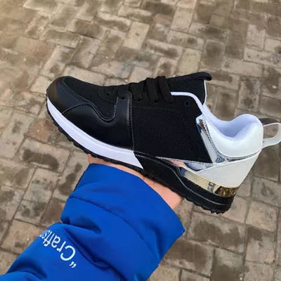 Casual sports shoes with thick soles in green, black, and pink colors