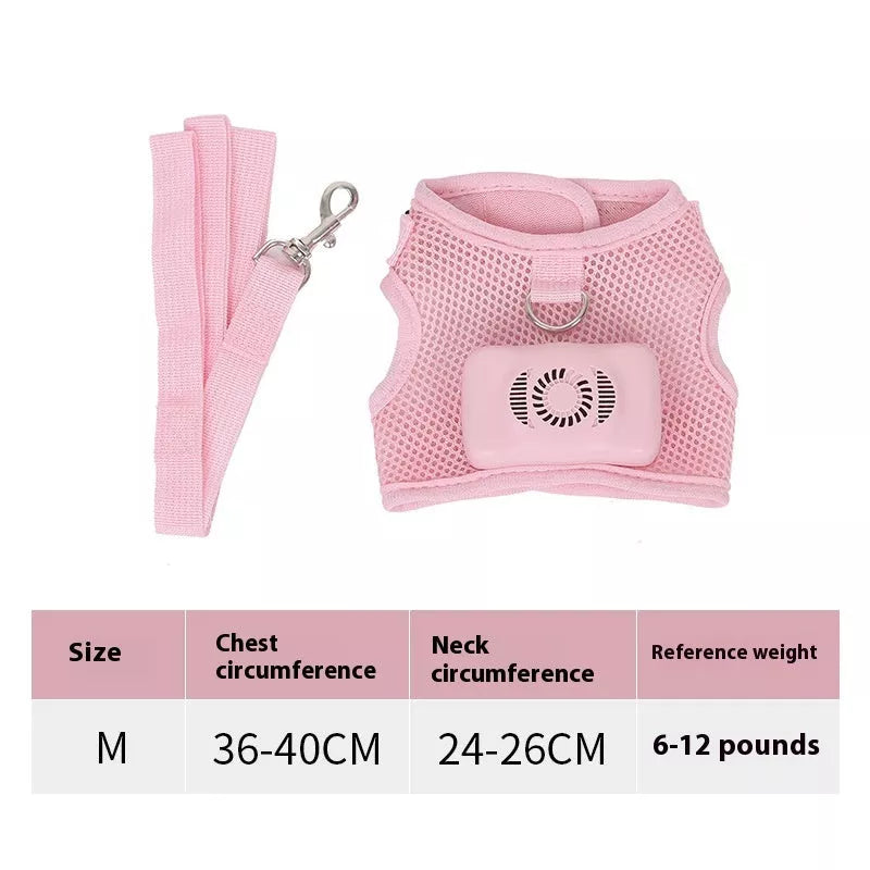 Small dog wearing mint green cooling vest harness with air conditioner