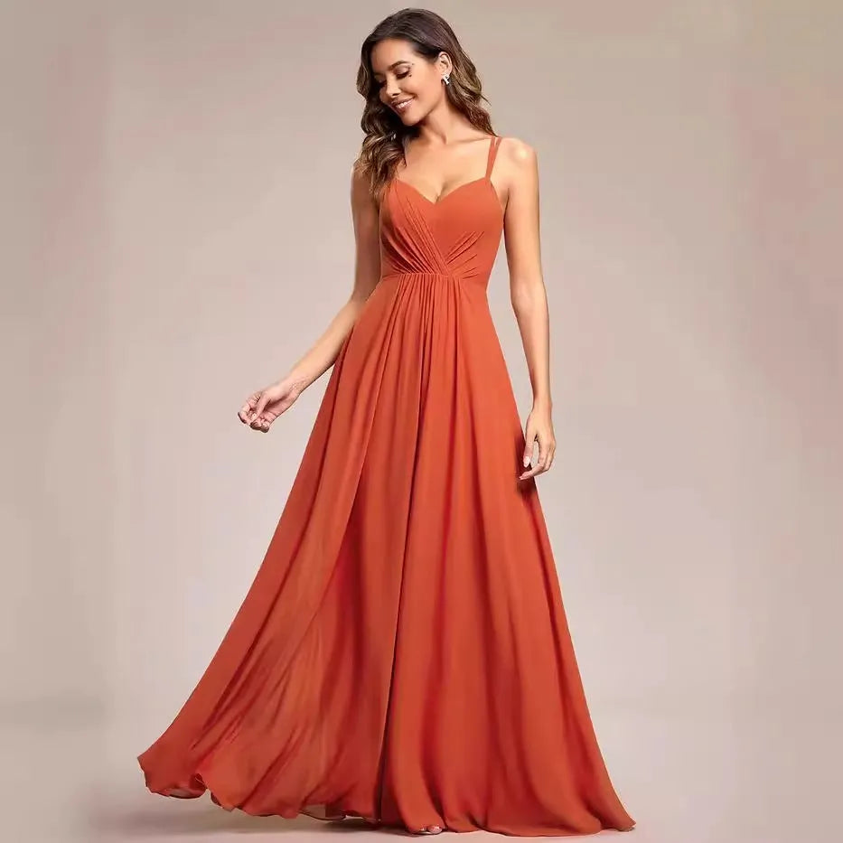Women's sleeveless long dress with sling neckline and pleated A-line skirt in a solid colour.