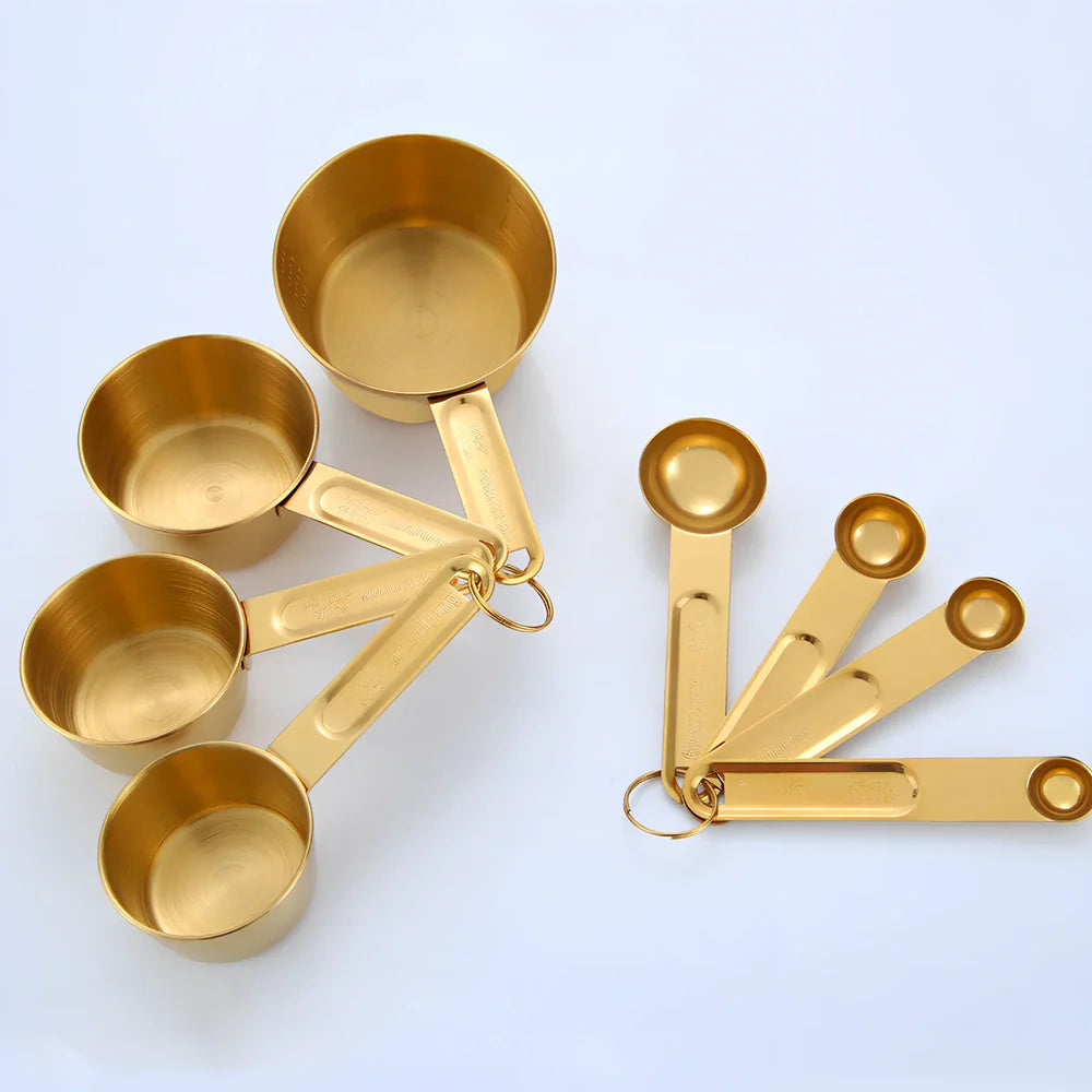 Stainless steel measuring spoons and cups set with engraved markings and removable storage rings