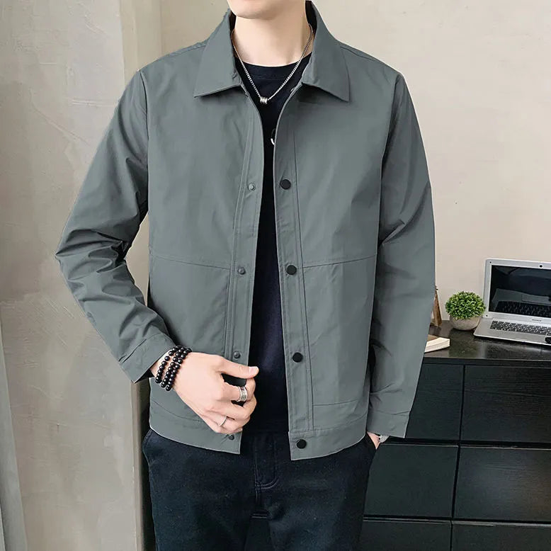 Man wearing a lightweight grey Korean-style single-layer polyester jacket for spring.