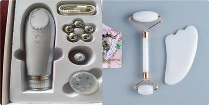White jade facial roller with double heads and matching scraping board on dark surface