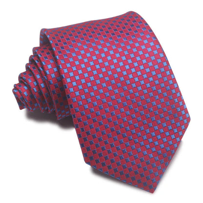 Close-up of a red and black striped jacquard weave tie with an arrow tip, showing texture.