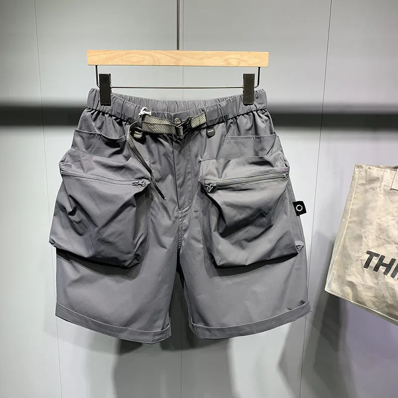 Men's large size workwear shorts with loose fit and practical pockets, above knee length casual summer shorts in black or grey with straight leg hem and non-iron treatment available in sizes M to 5XL