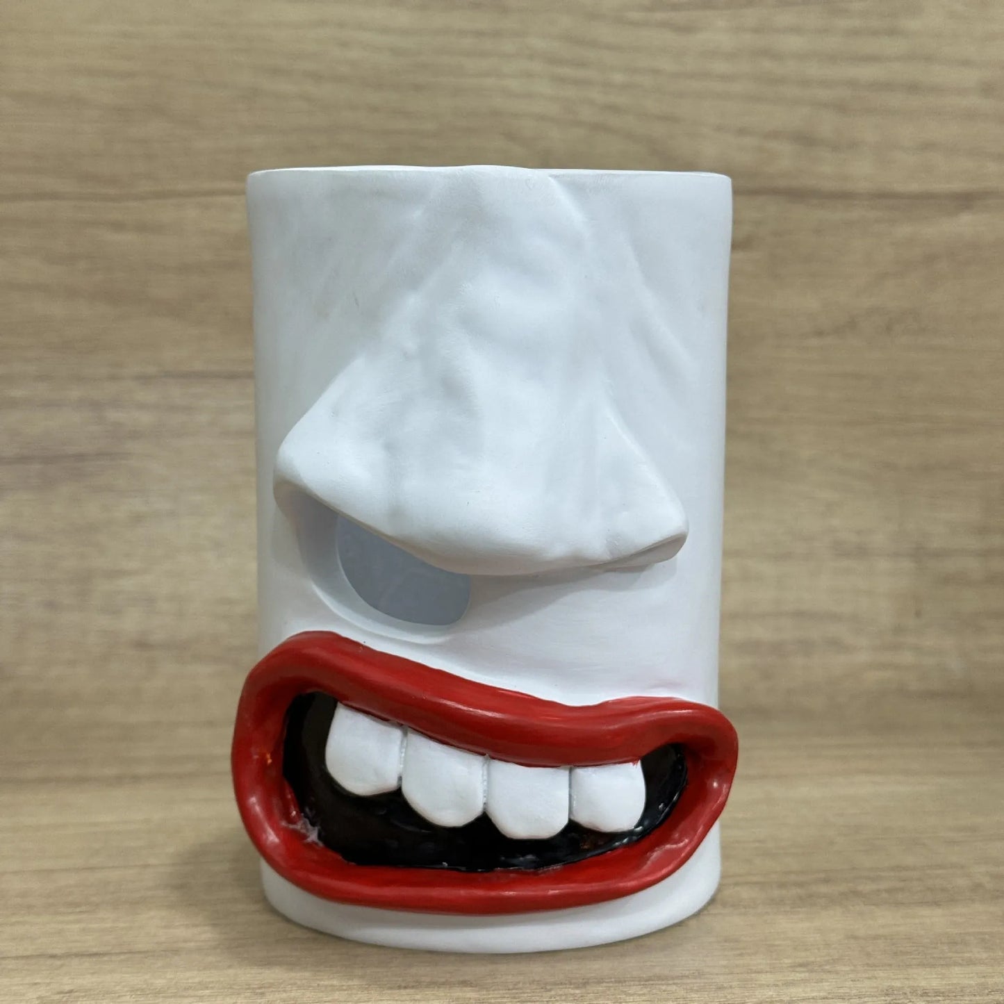 Colourful cartoon character resin tissue box holder on a wooden desk