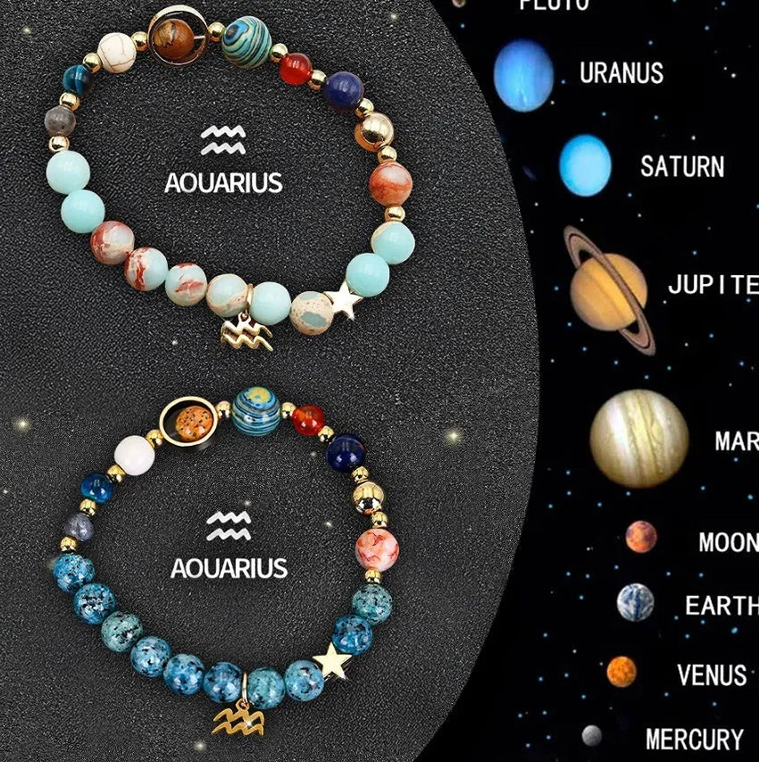 Set of two natural stone beaded bracelets showing zodiac sign designs on an elastic cord.