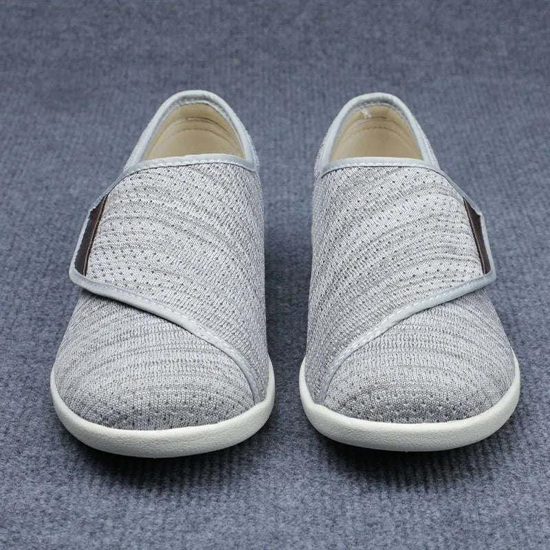 Beige leisure shoes for elderly with Velcro strap and rubber foam sole.