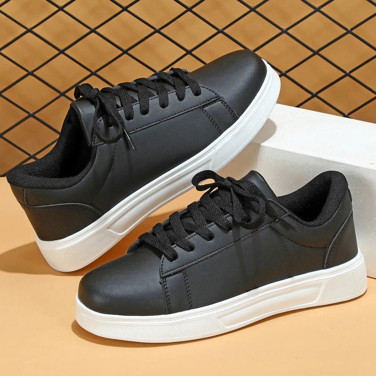 Beige brown women's low-top platform casual sneakers with a cross strap and round toe on a white background.