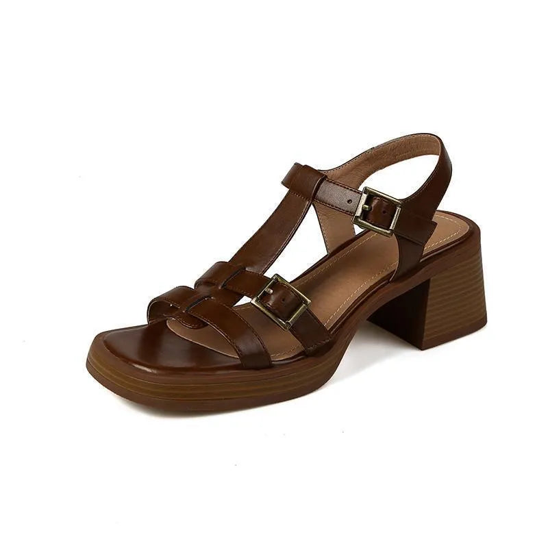 Black women's retro sandals with T-buckle, chunky heel, and open square toe.
