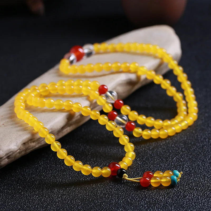Women's crystal necklace with 108 geometric beads and lucky cat charms