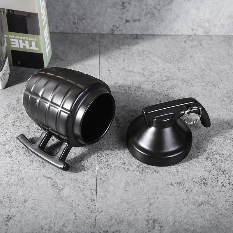 A white or black ceramic coffee mug with a grenade-inspired design and a secure lid for on-the-go convenience.