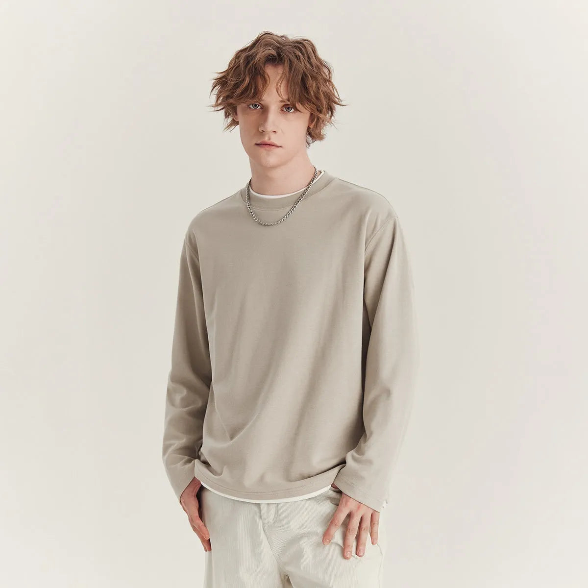 Men's loose fit long-sleeved cotton blend t-shirt in solid colour on hanger